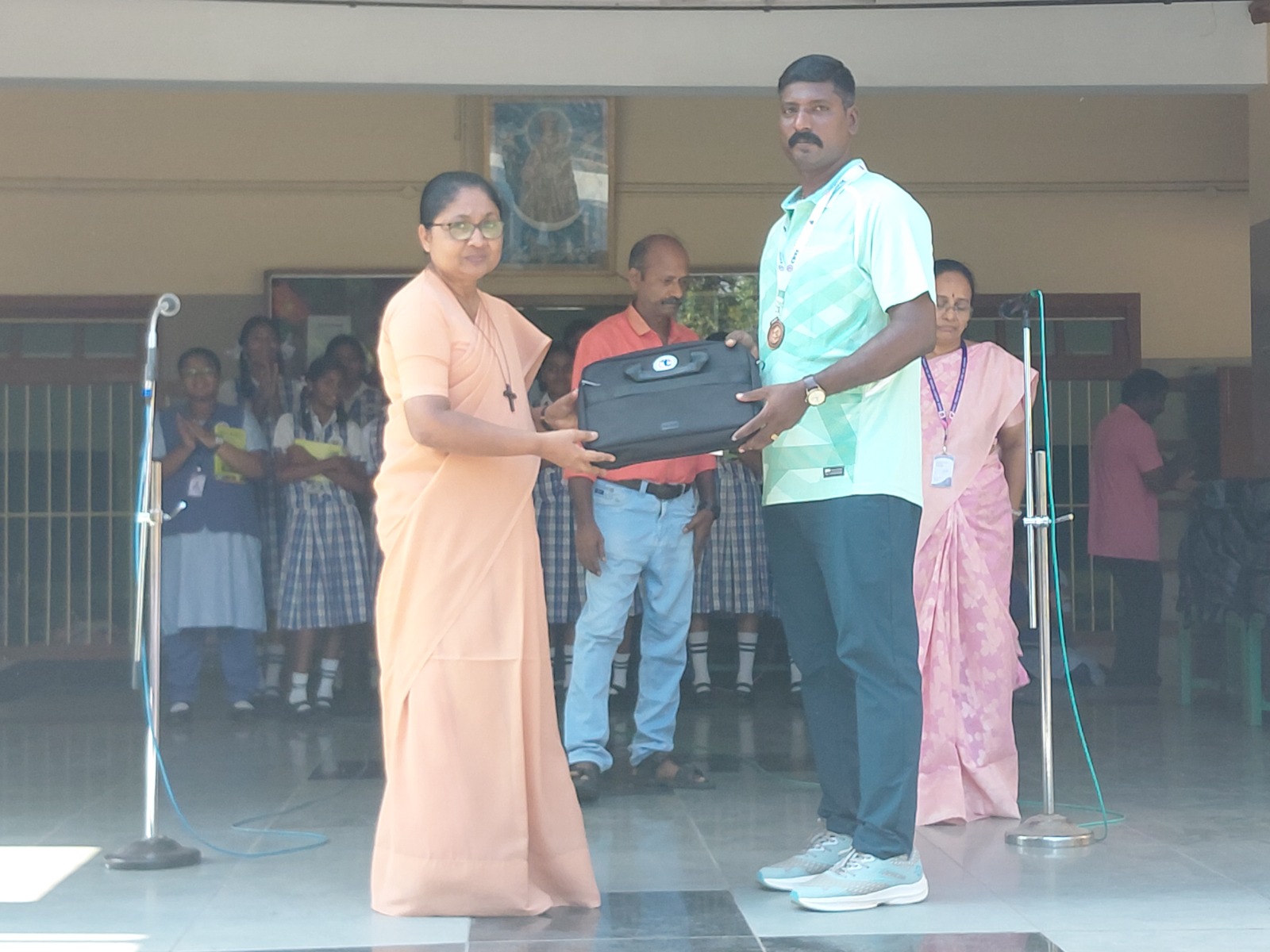 Principal Rev. Sr. Sherly Sebastian felicitated Mr. Raja, our P.E.T